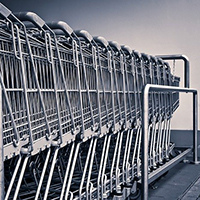 Photo of a row of shopping trolleys. From Michael Gaida on Pixabay