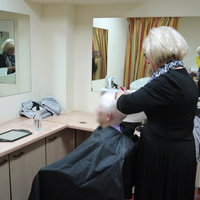 Photo of haridresser with client