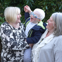 Photograph of one of SRSBs Little Sparklers with his mum and grandma