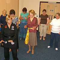 Photograph of SRSB clients at the Thai Chi group