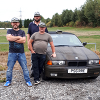 Photo of the team of three men doing the charity Drive for SRSB with their car