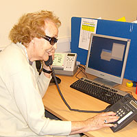Photograph of a volunteer ringong a client