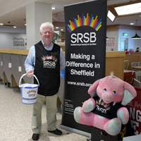 Photograph of SRSB volunteer at a store collection