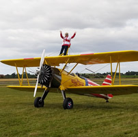 Photo of someone standing on top of a plane at last years event