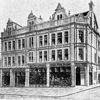 Black and white photograph of previous building on West Street