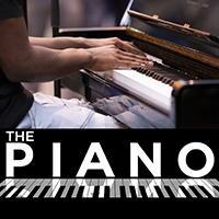 Photo of hands poised above some piano keys with the words The Piano underneath