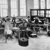 Old black and white photo of blind and partially sighted people making brushes
