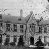 Black and white photo of the exterior of the old school on Manchester Road