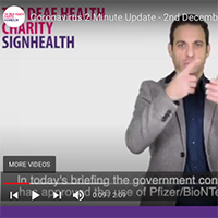 Picture is a still from the video from Deaf Health Charity Sign Health with somone doing sign language 
