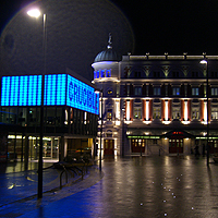 Photo of the exteriors of the Crucible and Lyceum lit up at night time