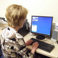 Photograph of someone using a computer