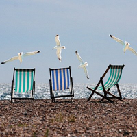 Photo of some deckchairs on a beach