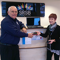 Photograph of presentation of equipment at SRSB