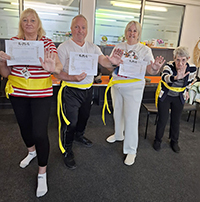 People showing their certificates for Tai Chi